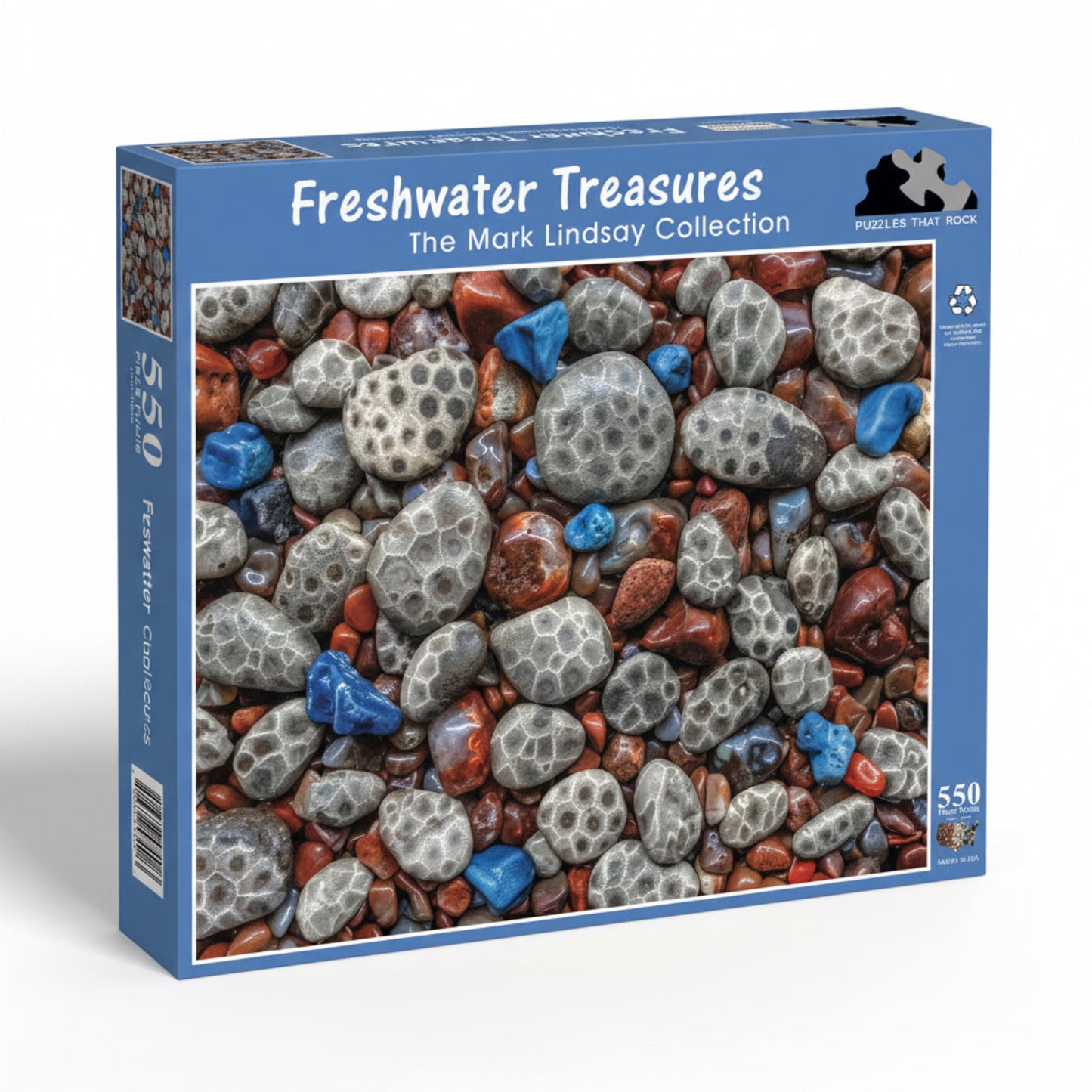 Jigsaw puzzle box featuring a Petoskey stones, Leland Blue, and Agates. The blue box says 'Freshwater Treasures' and 'The Mark Lindsay Collection' in text.