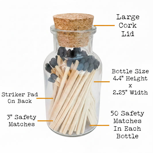 Glass bottle with matches and cork lid, labeled with dimensions and features, against a natural background.