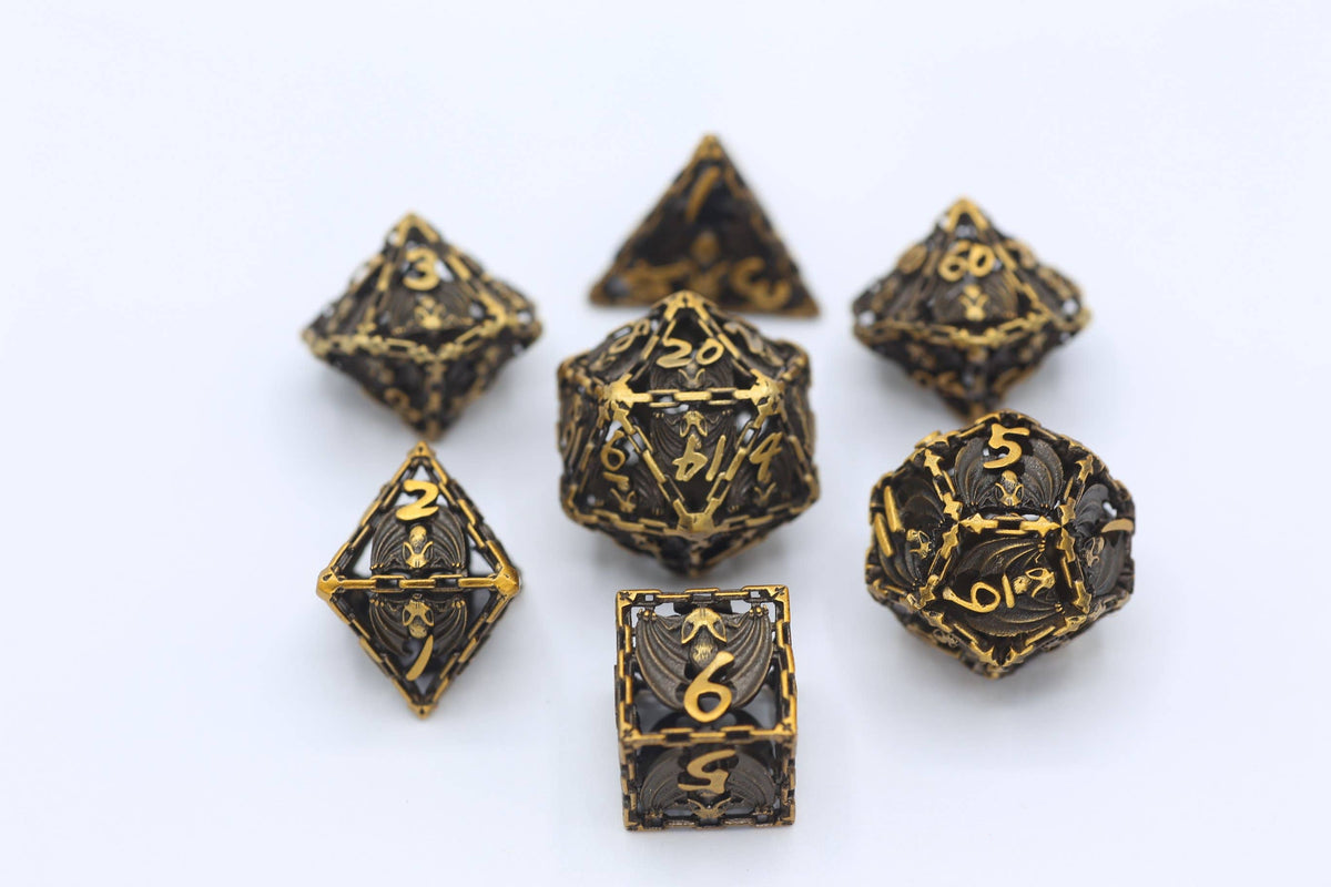 Ancient Gold Hollow Metal Bat Polyhedral Dice Set