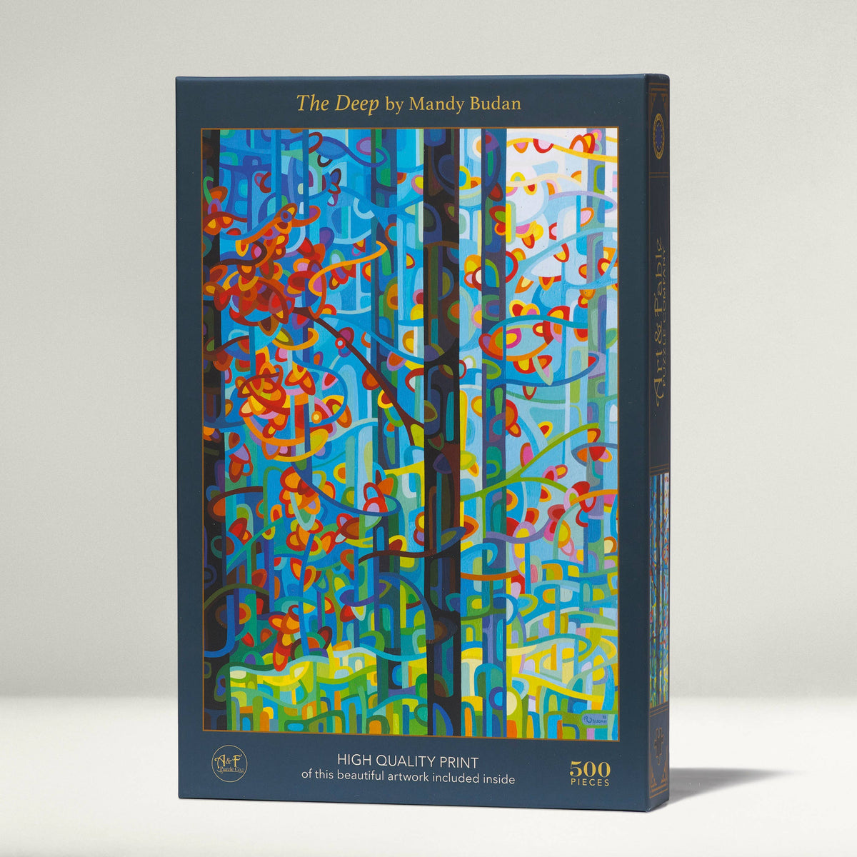 Jigsaw puzzle box with colorful abstract design and 'The Deep' by Mandy Budan text on a white background