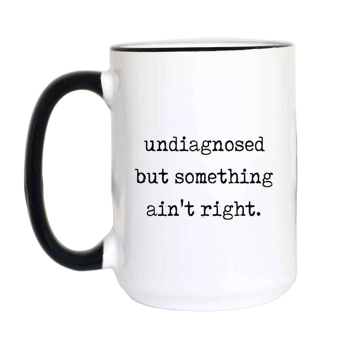 White mug with black handle and text 'undiagnosed but something ain't right.' on a white background.
