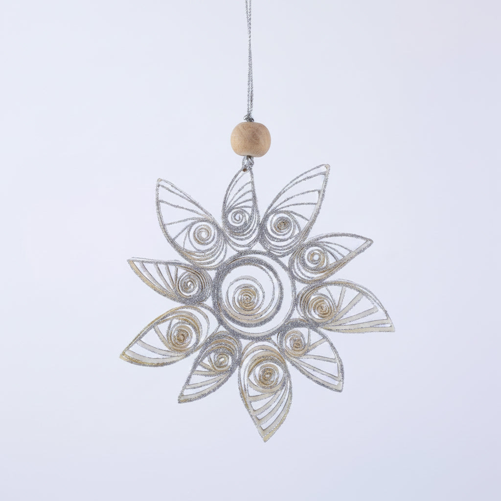 Decorative snowflake ornament on a light gray background