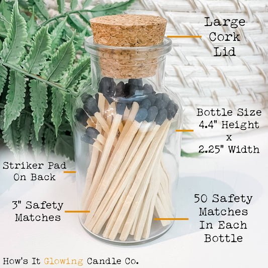 Glass bottle with matches and cork lid, labeled with dimensions and features, against a natural background.