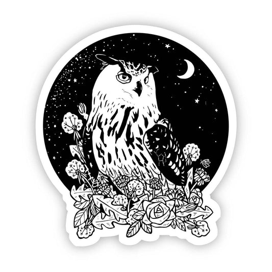 Black and white owl with floral elements and celestial background on a white background