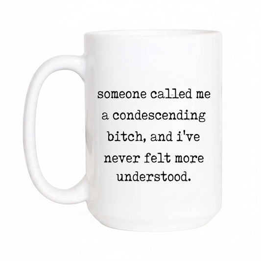 White mug with black text on a white background