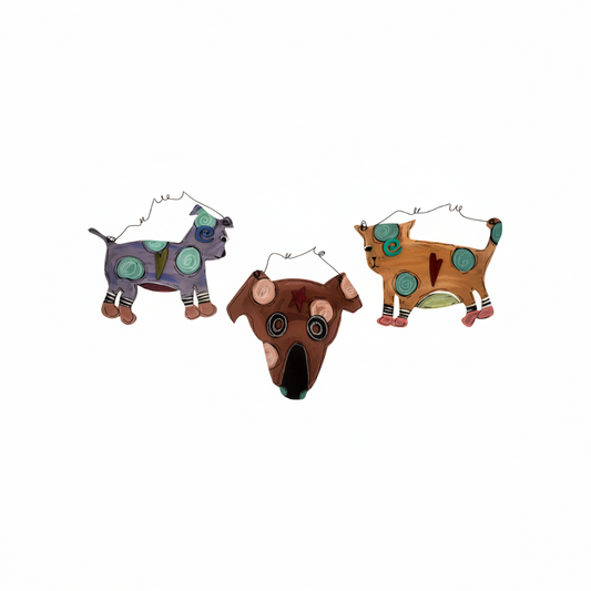 Three colorful dog-shaped plaques on a white background.