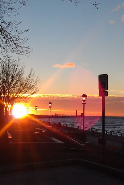 Sunset over the Boardwalk in Grand Haven, MI. Photo credit Cristine Grimm.