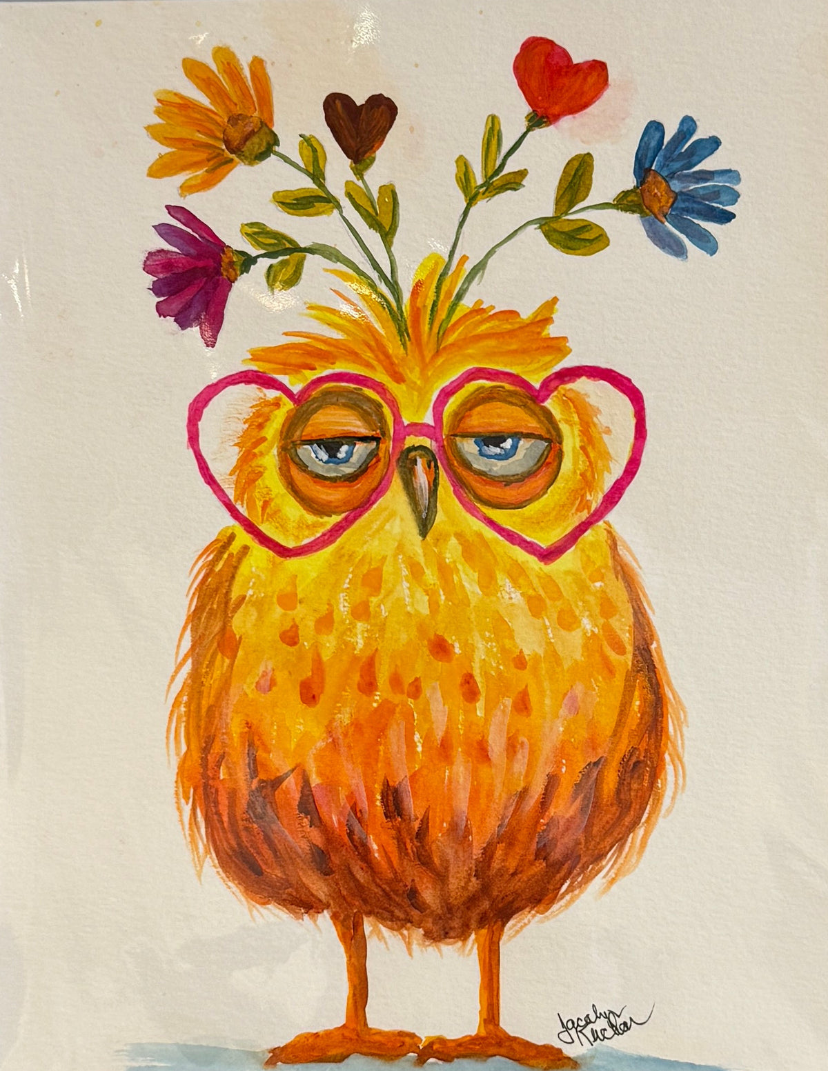 A framed art print featuring a whimsical illustration of a fluffy yellow-orange owl wearing pink heart-shaped glasses, with colorful flowers growing from its head, set against a white mat and white frame.