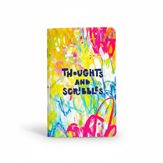 Colorful notebook with 'Thoughts and Scribbles' text on a white background