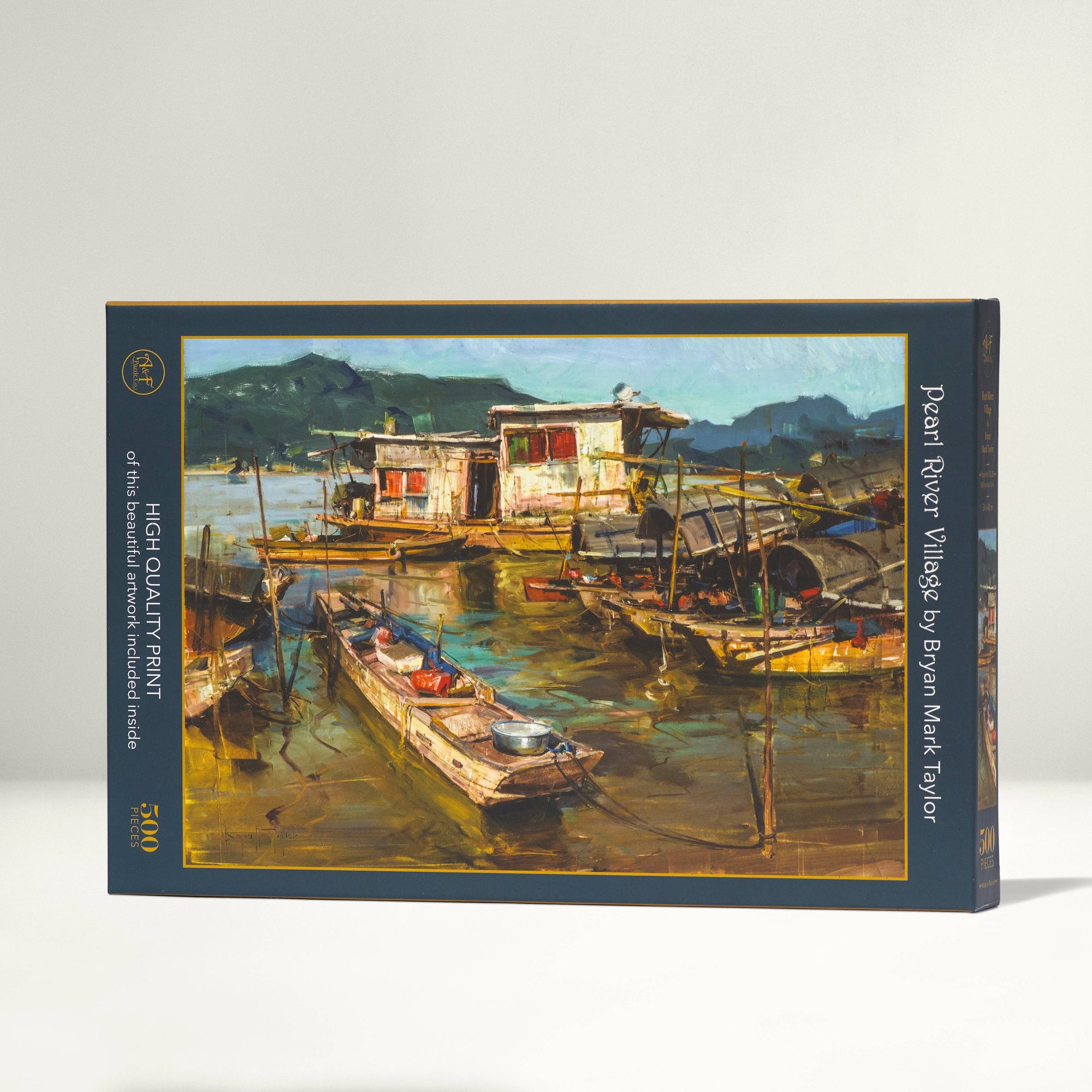 Art print puzzle packaging with a scenic depiction of boats and houses on a lake.