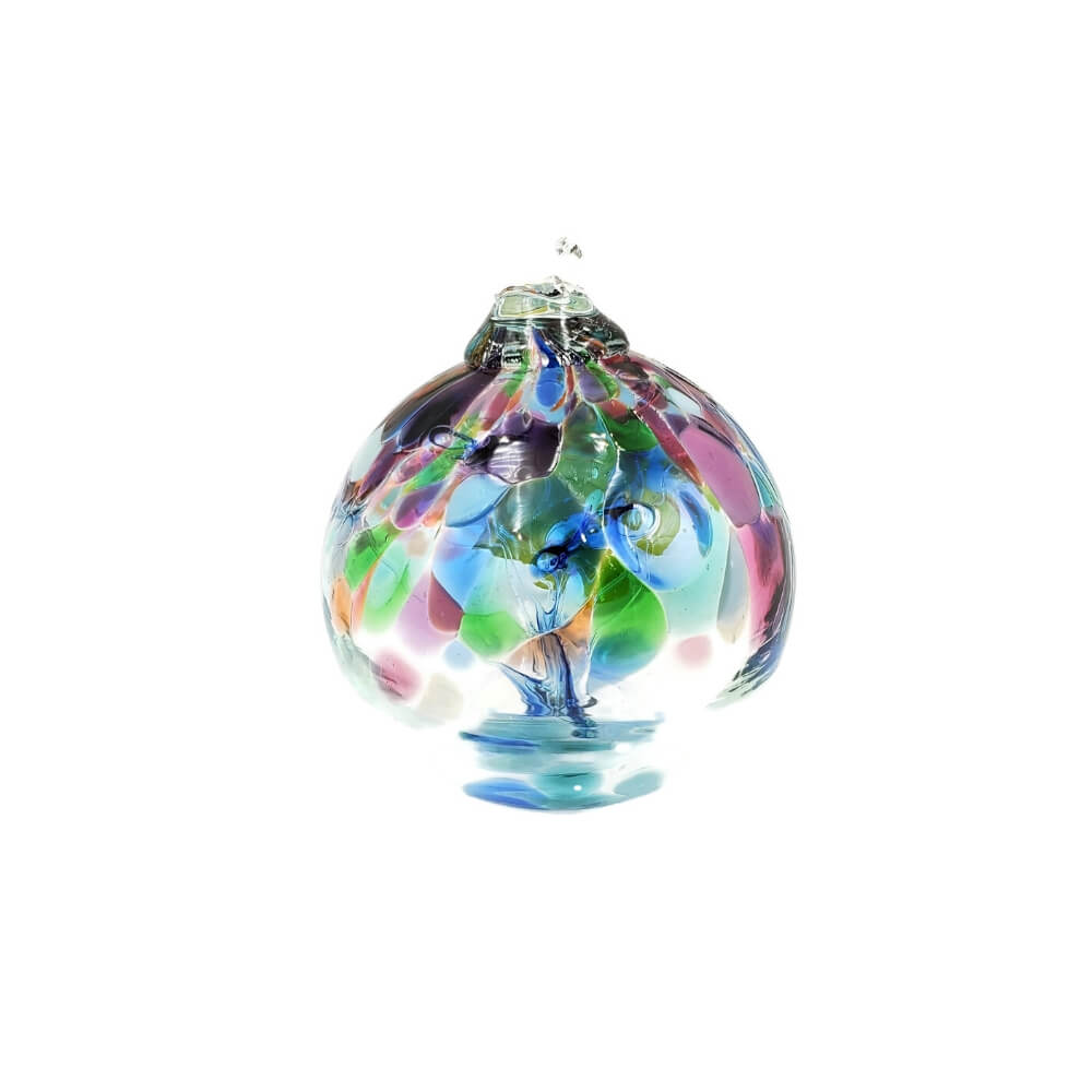 Clear glass ornament with accent colors of blue, pink, orange, and yellow. Strands of glass seem to stretch through the middle of the orb.