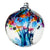 Clear glass ornament with accent colors of blue, pink, orange, and yellow. Strands of glass seem to stretch through the middle of the orb.