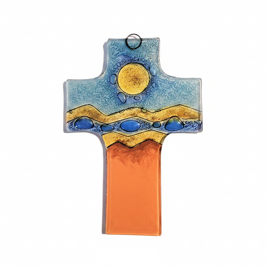 A medium-sized wall cross featuring a wavy blue and orange landscape with a yellow sun.