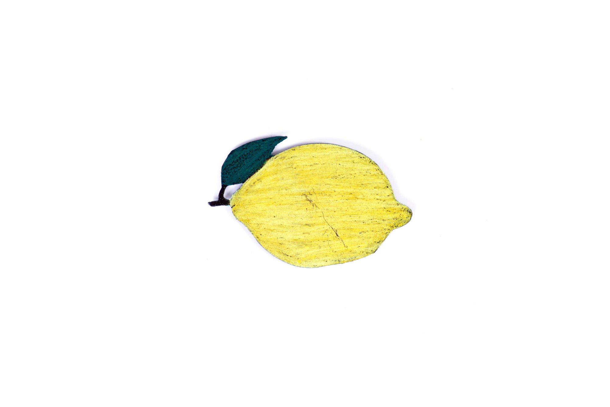 A horizontal flat metal lemon painted yellow. It has a short stem and a green leaf on the left end.