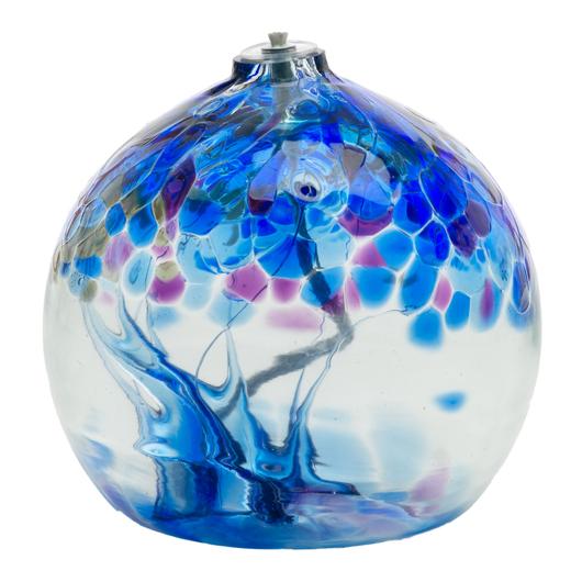 Blown clear glass with deep cobalt blue and accents of purple, and dark green.  Features a wick for use as an oil lamp.